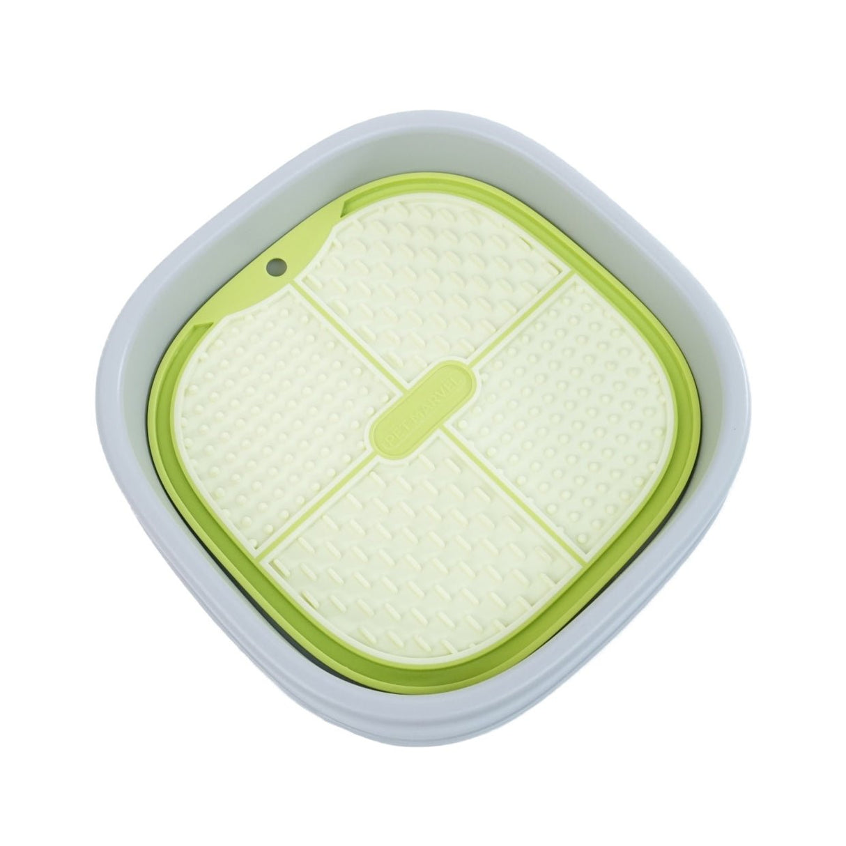 a green lick mat is set up on a lick holder