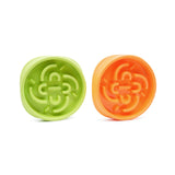 front view of a green and orange slow feeder bowl that give dogs a healthy and enjoyable habit